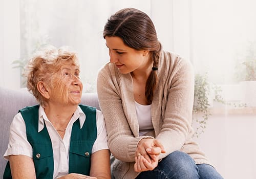 Senior talking with family member
