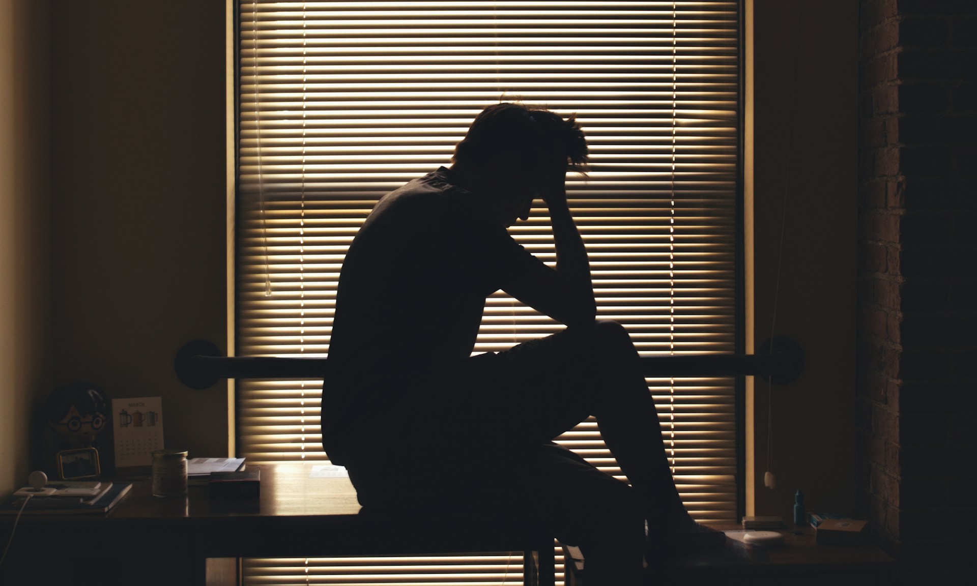 caregiver stressed silhouetted